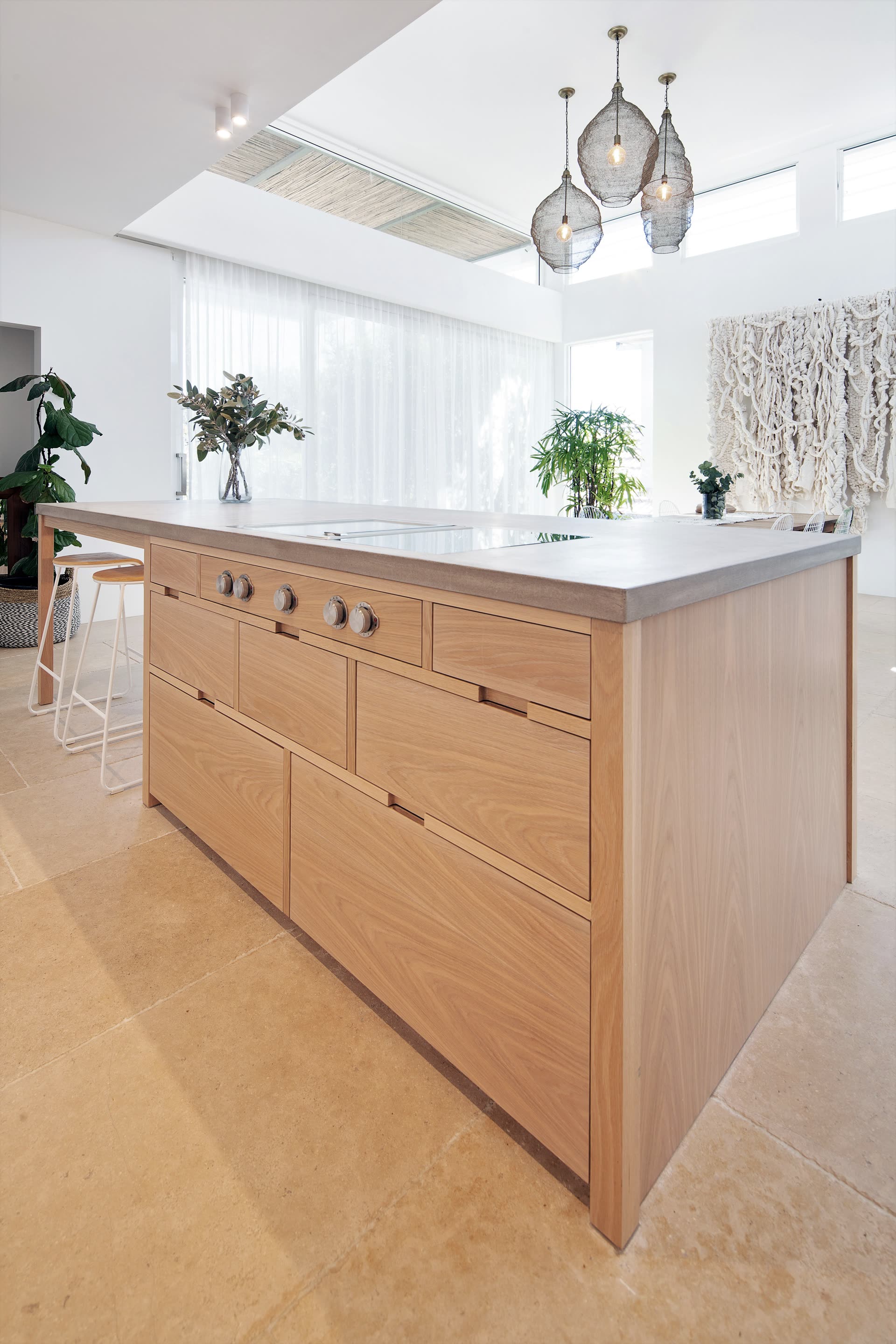 Kitchen with island bench and stone splashback